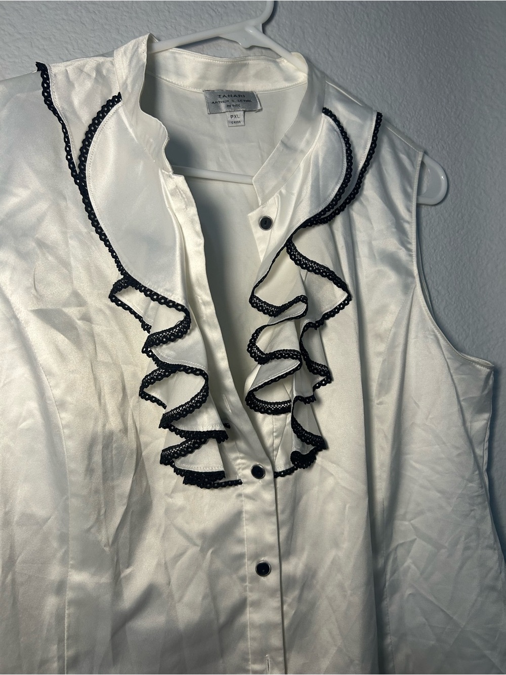 White Sleeveless Ruffle Blouse with Black Trim